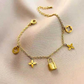 Gold Charm Bracelet with Lock & Star Details