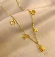 Gold Layered Charm Necklace with Lock & Star Details